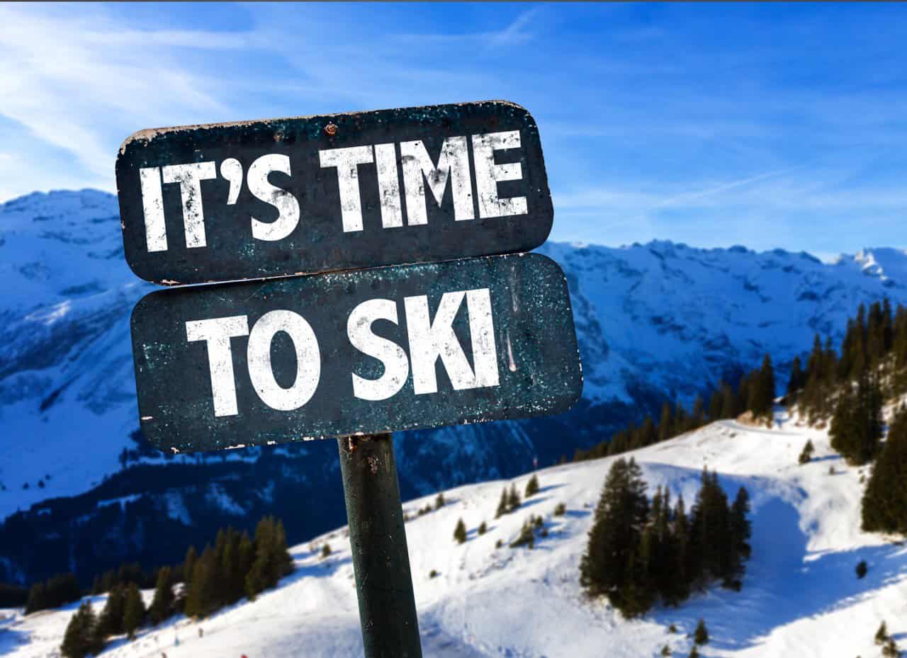 It's time to ski sign stuck in a mountain for Scotland Skiing