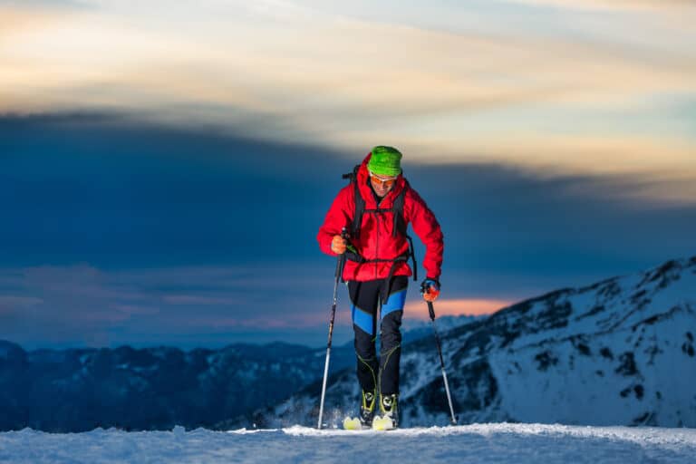 Ski touring at night in the last hours of the day