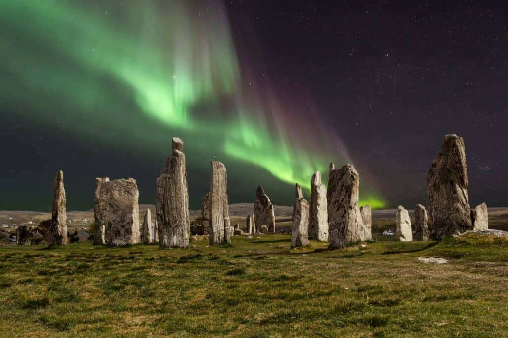 The Callanish Stones with the northern lights over them for "Can you see the Northern Lights in Scotland?"