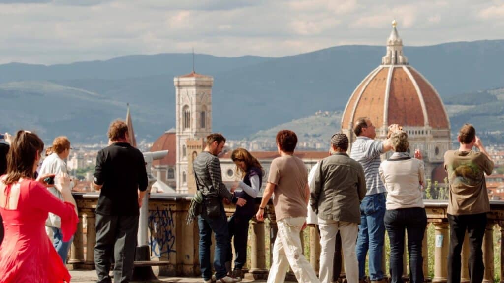Piazzale Michelangelo full of tourists blocking the view.