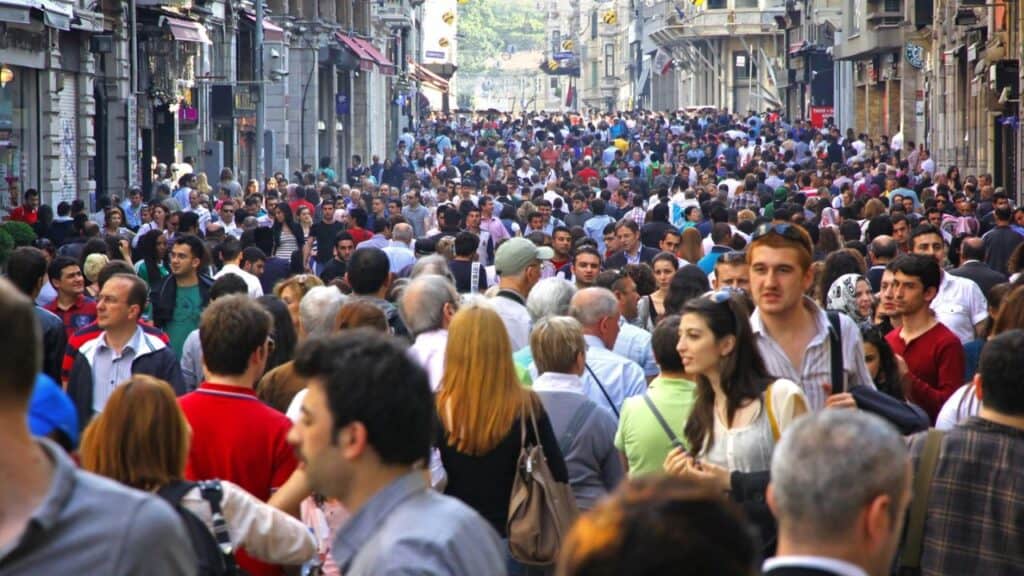 ISTANBUL, TURKEY - MAY 5, 2012: People walking on Istiklal Street on May 5, 2012 in Istanbul, Turkey. It is the most famous street in Istanbul, visited by nearly 3 million people in a single weekends day