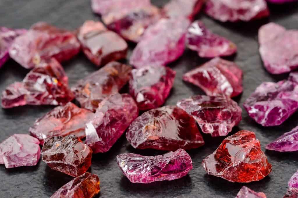 a pile of raw garnet stones