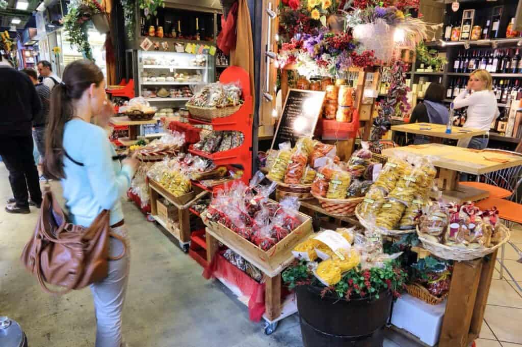 FLORENCE, ITALY - APRIL 30, 2015: People shop at Mercato Centrale market in Florence, Italy. The market is an ultimate Italian shopping experience. It was opened in 1874.