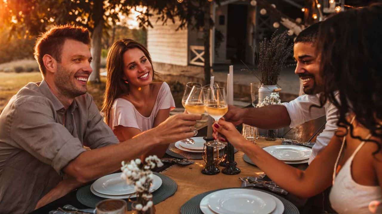 A group of people clinking glasses