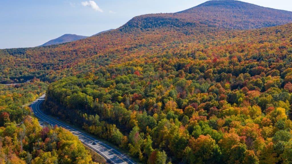 Aerial view of fall foliage along the Catskill Mountains in upstate New York along Five State Lookout.