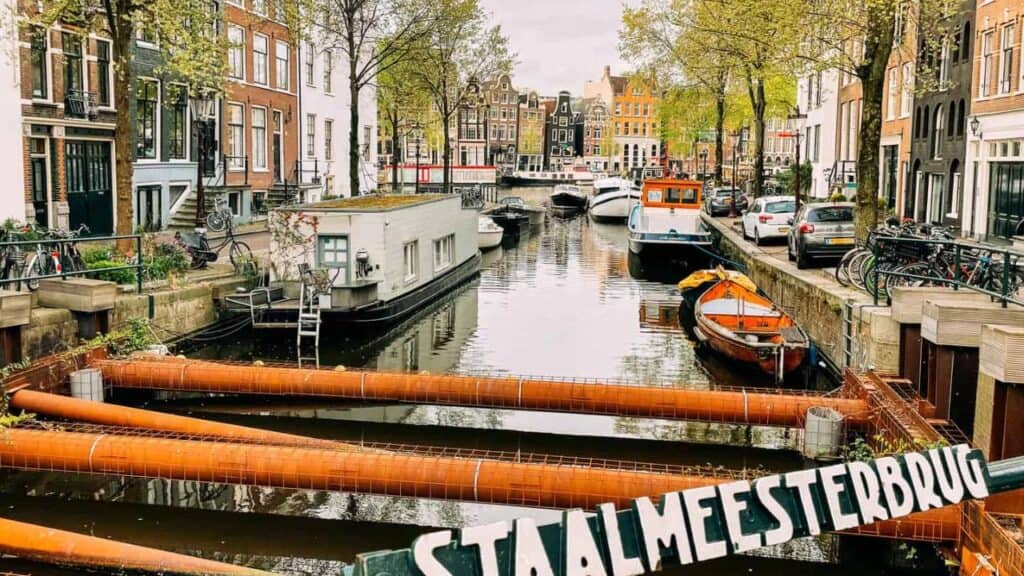 A small canal is a cute neighborhood in Amsterdam