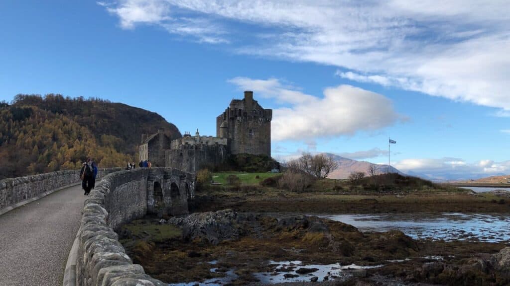 Eileen Donan Castle at the intersection of three sea lochs with blue sky behind