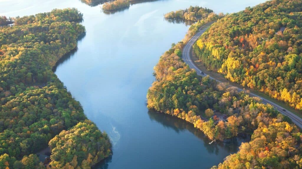 Curving road along Mississippi River during autumn