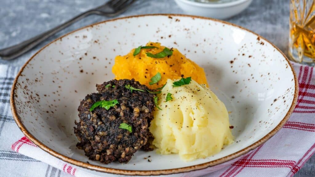 Haggis, neeps and tatties (haggis with turnips and potatoes) - traditional Scottish dish for Burns Night