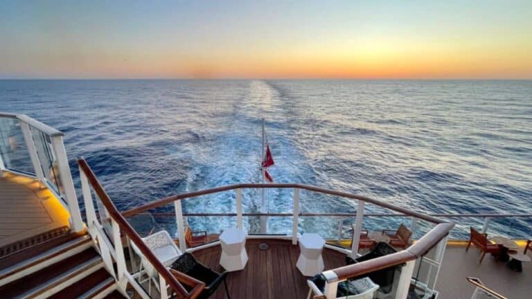 Cruise ship wake with sunrise on the horizon