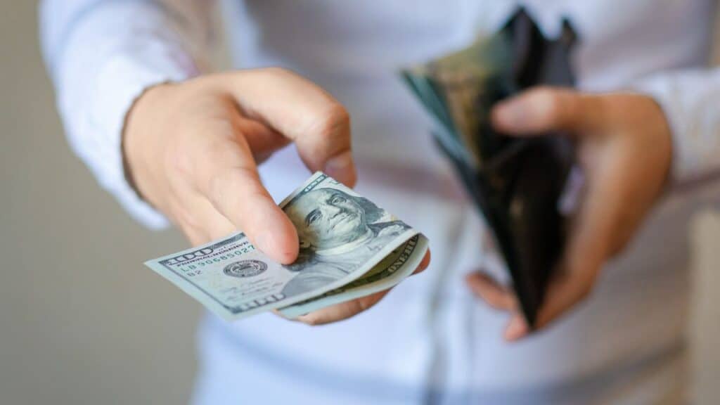 Man gets money from the wallet