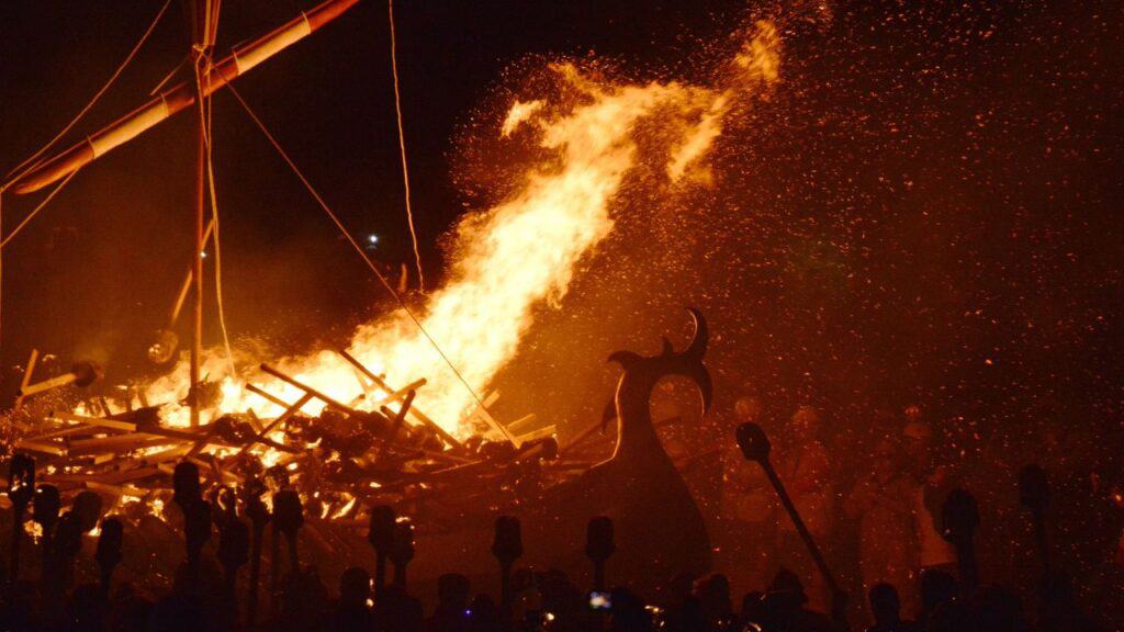 Viking ship on fire during the fire festival in Shetland, Scotland.