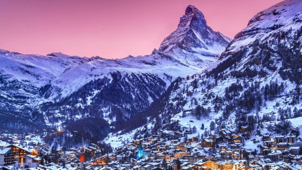 Zermatt, Switzerland - Zermatt town with Matterhorn with Christmas illumination during twlight. Zermatt is a famous recreational place for outdoor activities for vacations"