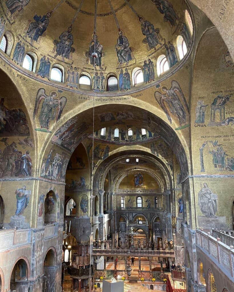 Inside the extremely gilded St. Marks Basilica in Venice Italy