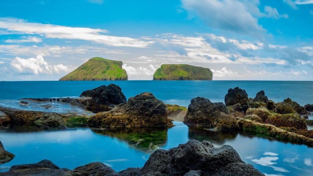 Terceira Island coast and Ilheus das Cabras. Sea landscape.