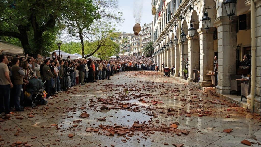 CORFU, GREECE - APRIL 18, 2009: At 11:00am on Holy Saturday, as is customary, Corfians throw water filled jugs and pots from balconies at the Liston Spaniada promenade on Holy Saturday, to celebrate the Resurrection.