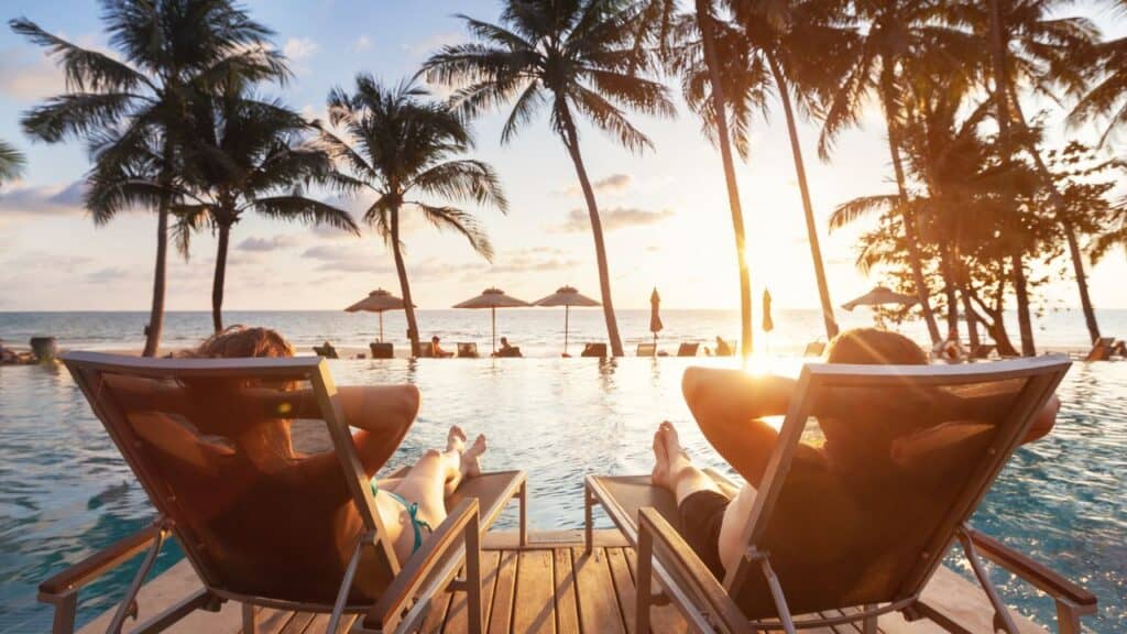 luxury travel, romantic couple in beach hotel